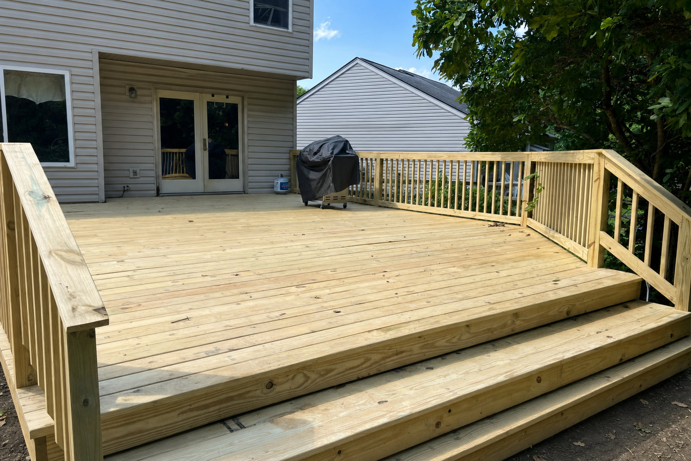 Pressure-treated wood deck construction